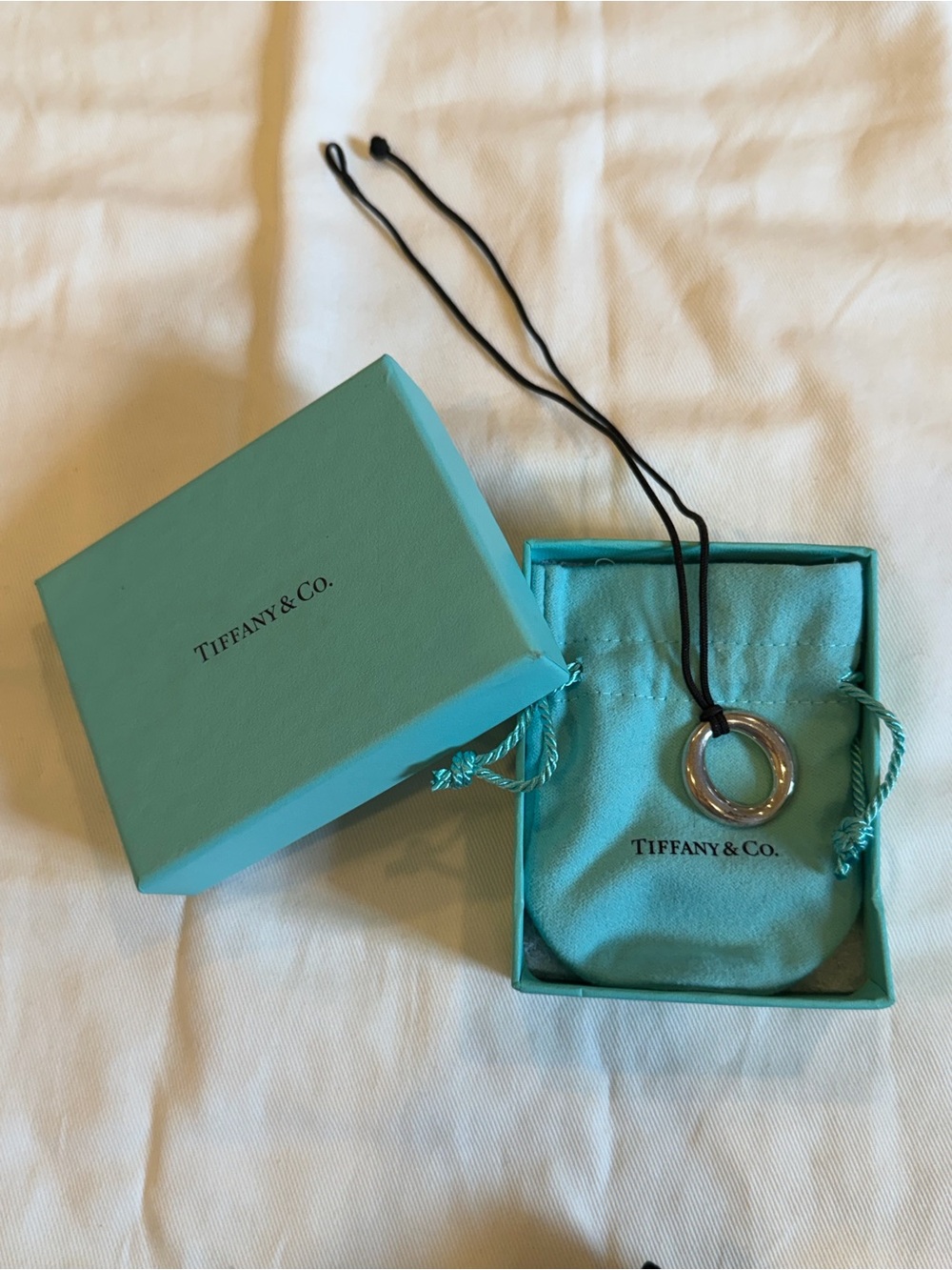 Tiffany & Co. Silver Ring Pendant Necklace with Blue Pouch